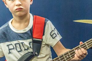 Backbeat Music Academy, portland, OR - a boy playing the bass during bass lessons at backbeat music academy