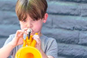 Backbeat Music Academy, portland, OR - boy trumpet playing the trumpet at a Try Everything summer camp