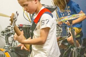 Backbeat Music Academy, portland, OR - boys playing the drums and guitar together during music lessons at backbeat music academy