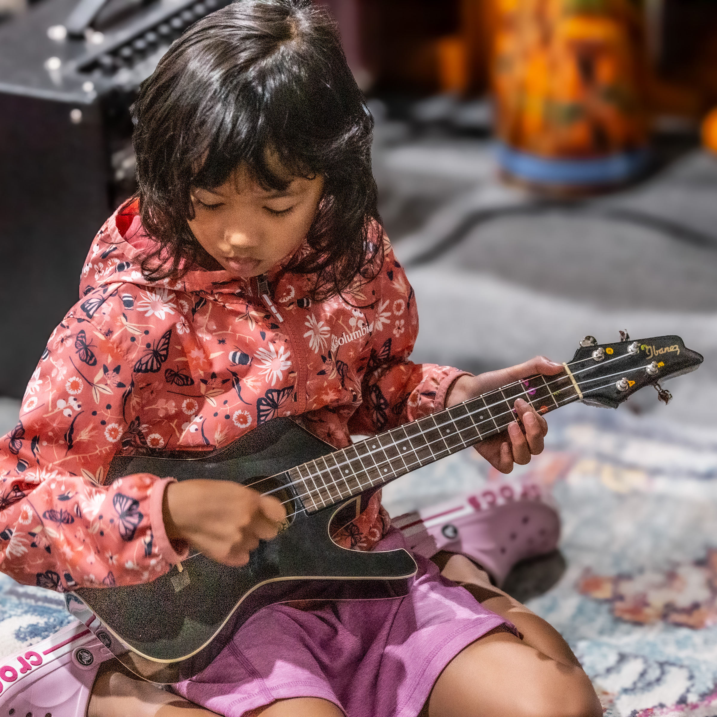 Backbeat student playing the ukulele